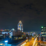 Sandton skyline at night, showcasing urban density driving self-storage demand