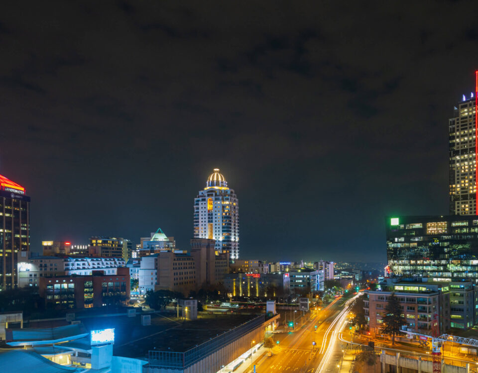 Sandton skyline at night, showcasing urban density driving self-storage demand